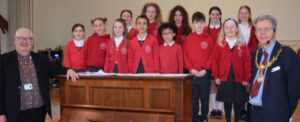 Choir Master Eifion Davies and Cllr John Andrew with the choir